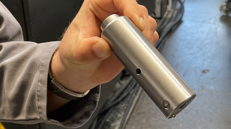 Hand holds a transmission component for electric lorries